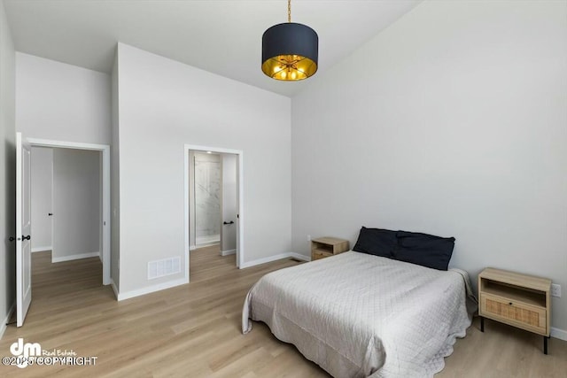 1029 Shelley Ave, Homer, AK 99603 - bedroom featuring light wood-style flooring and a high ceiling