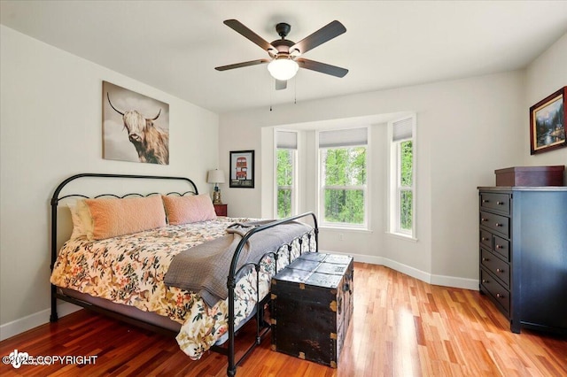 3361 N Inspiration Loop, Wasilla, AK 99654 - bedroom with light wood-type flooring, baseboards, and ceiling fan