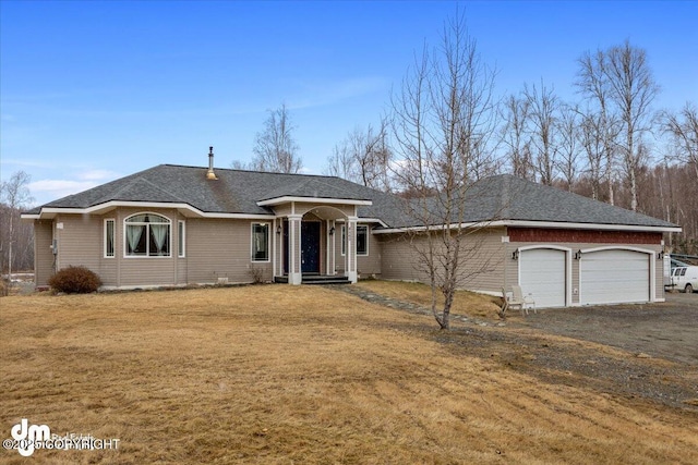 8560 W Hollywood Rd, Wasilla, AK 99623 - single story home with an attached garage, a front lawn, and dirt driveway