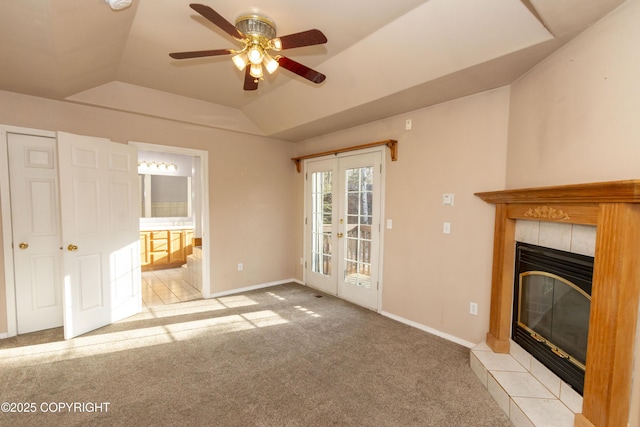 10127 Crest View Ln, Eagle River, AK 99577 - unfurnished living room featuring a ceiling fan, light carpet, a tiled fireplace, lofted ceiling, and baseboards