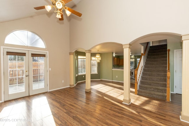 10127 Crest View Ln, Eagle River, AK 99577 - interior space featuring french doors, a ceiling fan, decorative columns, arched walkways, and wood finished floors