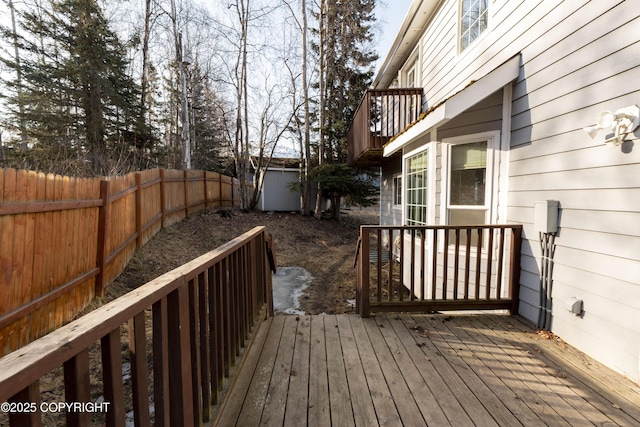 10127 Crest View Ln, Eagle River, AK 99577 - wooden deck featuring an outbuilding, a fenced backyard, and a shed