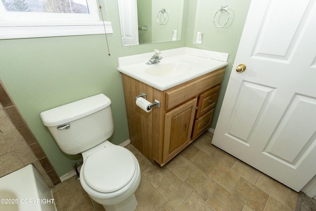 10127 Crest View Ln, Eagle River, AK 99577 - bathroom with toilet, vanity, and baseboards