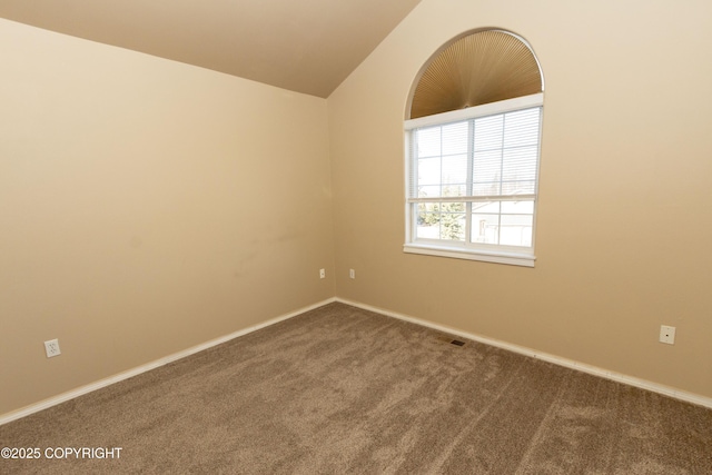 10127 Crest View Ln, Eagle River, AK 99577 - unfurnished room with dark carpet, visible vents, baseboards, and lofted ceiling