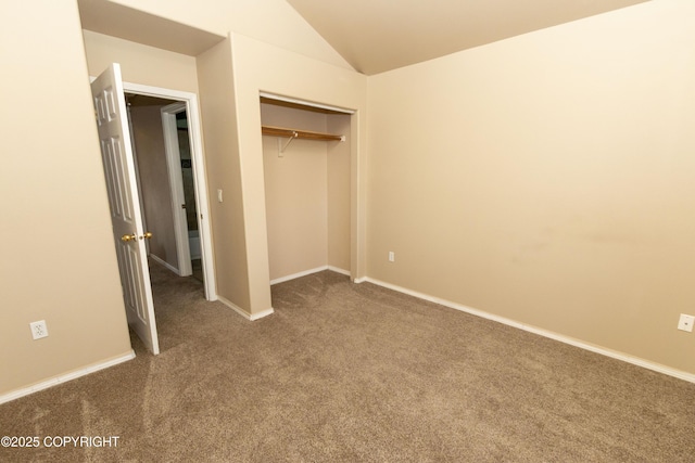 10127 Crest View Ln, Eagle River, AK 99577 - unfurnished bedroom with a closet, baseboards, carpet, and lofted ceiling