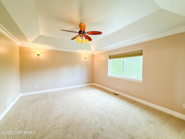 2731 E Tamarak Ave, Wasilla, AK 99654 - carpeted spare room featuring a raised ceiling, ceiling fan, ornamental molding, and baseboards