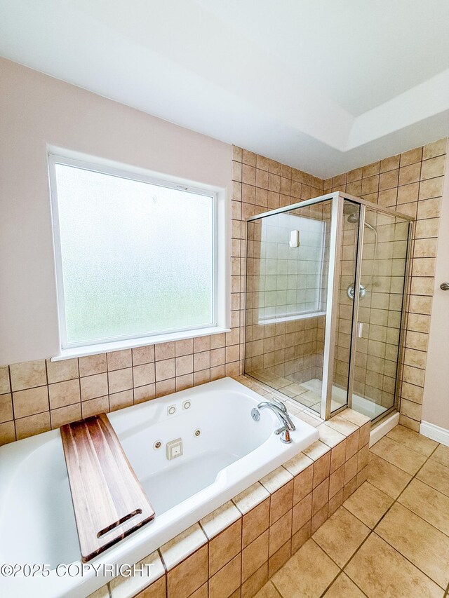 2731 E Tamarak Ave, Wasilla, AK 99654 - bathroom with a shower stall, a jetted tub, and tile patterned floors