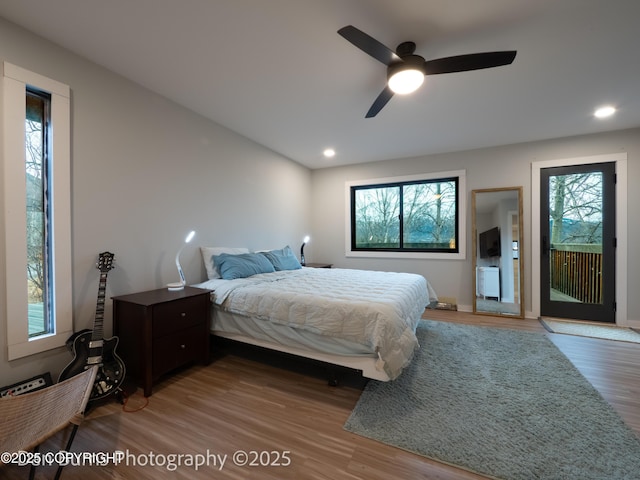 11730 Broadwater Dr, Eagle River, AK 99577 - bedroom featuring access to exterior, wood finished floors, recessed lighting, ceiling fan, and baseboards