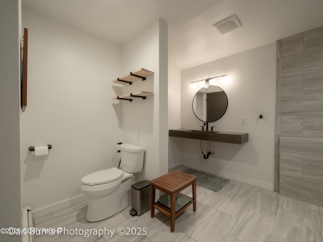 11730 Broadwater Dr, Eagle River, AK 99577 - bathroom featuring toilet and baseboards