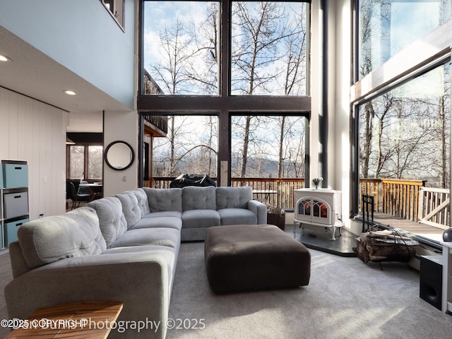 11730 Broadwater Dr, Eagle River, AK 99577 - living room with a high ceiling and a wood stove