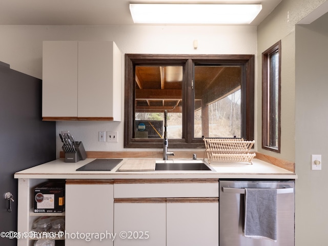 11730 Broadwater Dr, Eagle River, AK 99577 - kitchen with appliances with stainless steel finishes, white cabinetry, light countertops, and a sink