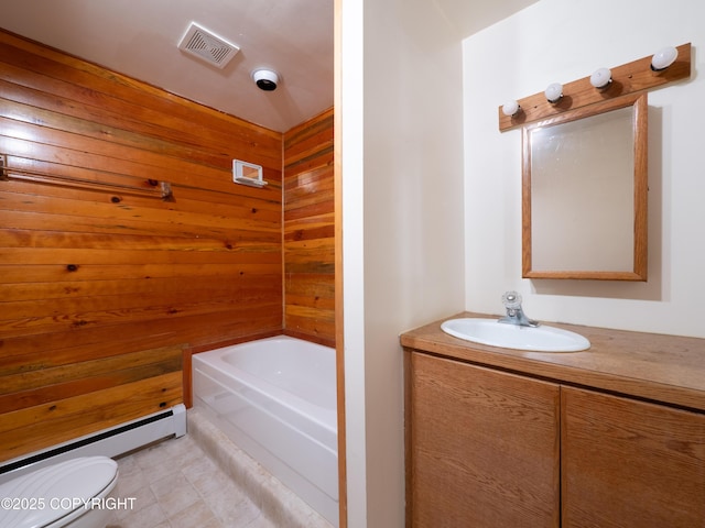 11730 Broadwater Dr, Eagle River, AK 99577 - bathroom featuring toilet, vanity, a bathtub, a baseboard radiator, and wood walls
