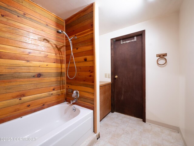 11730 Broadwater Dr, Eagle River, AK 99577 - bathroom with shower / tub combination and wooden walls