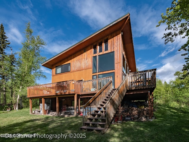 11730 Broadwater Dr, Eagle River, AK 99577 - back of property with a deck, stairs, and a yard