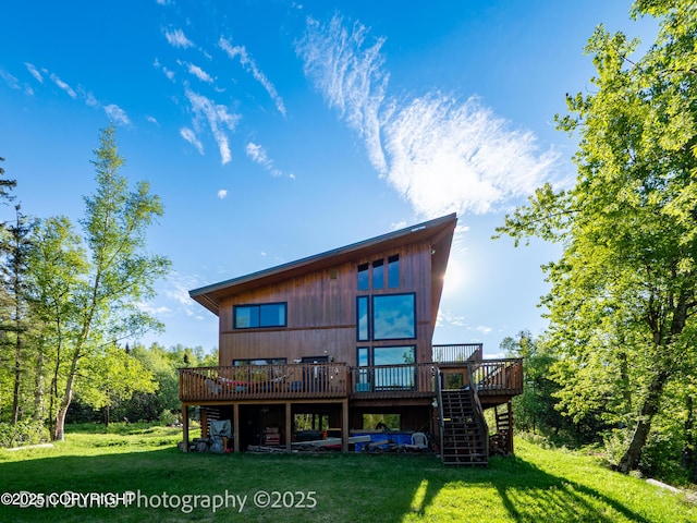 11730 Broadwater Dr, Eagle River, AK 99577 - back of property featuring stairway, a wooden deck, and a lawn