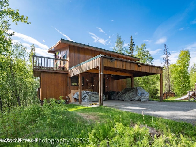 11730 Broadwater Dr, Eagle River, AK 99577 - view of parking / parking lot featuring driveway and a carport