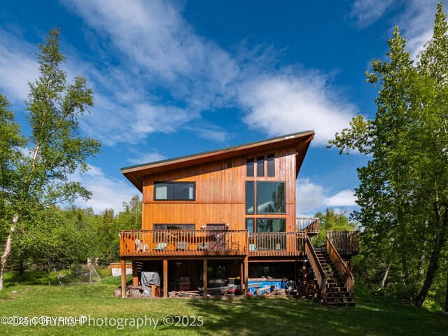 11730 Broadwater Dr, Eagle River, AK 99577 - back of house with a wooden deck, a lawn, and stairs
