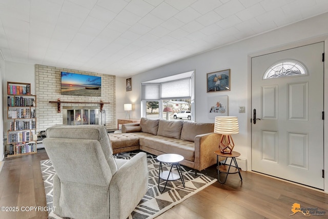 4303 E 3rd Ave, Anchorage, AK 99508 - living area with a brick fireplace and wood finished floors