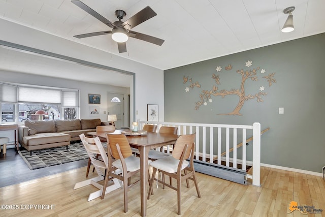 4303 E 3rd Ave, Anchorage, AK 99508 - dining space featuring baseboards, a ceiling fan, and wood finished floors