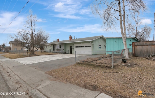 4303 E 3rd Ave, Anchorage, AK 99508 - ranch-style house with an attached garage, a chimney, driveway, and fence