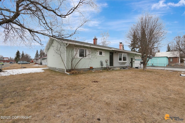 4303 E 3rd Ave, Anchorage, AK 99508 - view of front of house featuring fence, crawl space, and a chimney