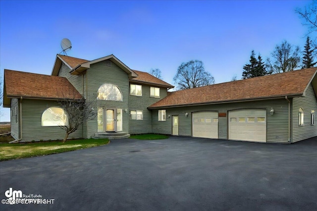 47366 Winridge Ave, Kenai, AK 99611 - view of front of home featuring asphalt driveway and an attached garage