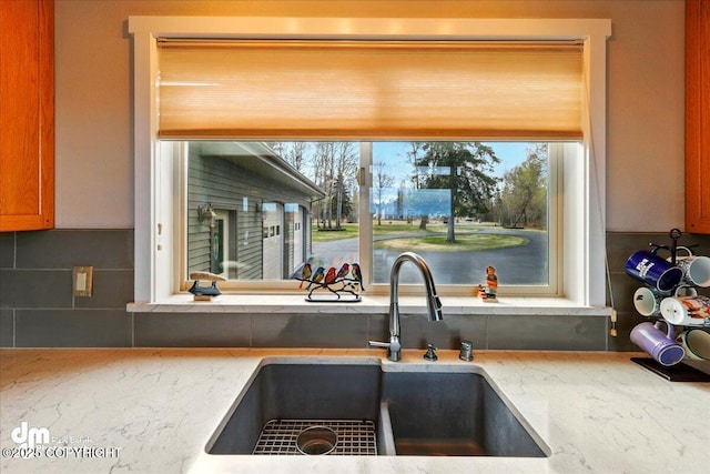 47366 Winridge Ave, Kenai, AK 99611 - kitchen with a sink, tasteful backsplash, light stone countertops, and plenty of natural light