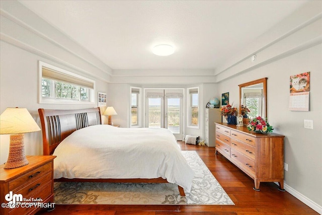 47366 Winridge Ave, Kenai, AK 99611 - bedroom featuring multiple windows, dark wood-style floors, access to exterior, and baseboards