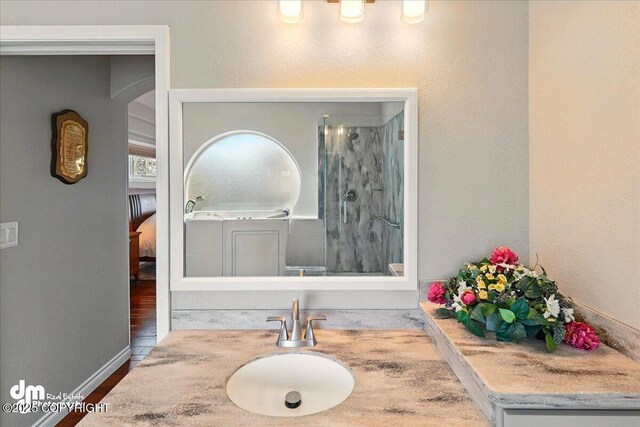 47366 Winridge Ave, Kenai, AK 99611 - full bathroom featuring a stall shower, wood finished floors, and vanity