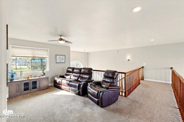 47366 Winridge Ave, Kenai, AK 99611 - cinema with light colored carpet, a ceiling fan, and baseboards