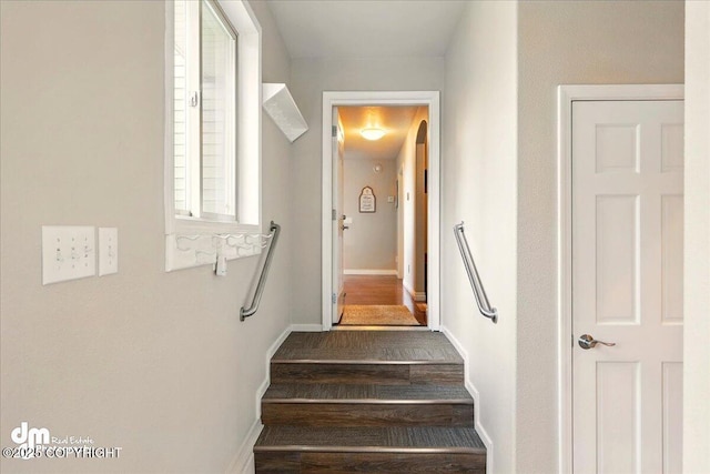 47366 Winridge Ave, Kenai, AK 99611 - stairway featuring baseboards, wood finished floors, and arched walkways