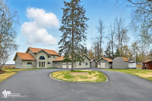 47366 Winridge Ave, Kenai, AK 99611 - view of front of property with asphalt driveway and a front yard