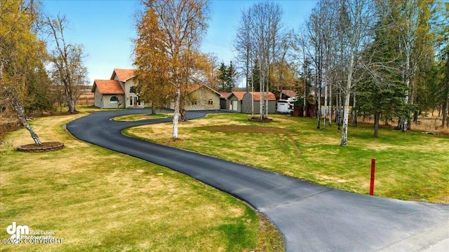 47366 Winridge Ave, Kenai, AK 99611 - view of home's community featuring asphalt driveway and a yard