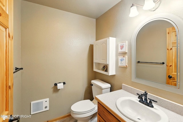 22045 Becharof Cir, Kasilof, AK 99610 - half bathroom with toilet, heating unit, and vanity