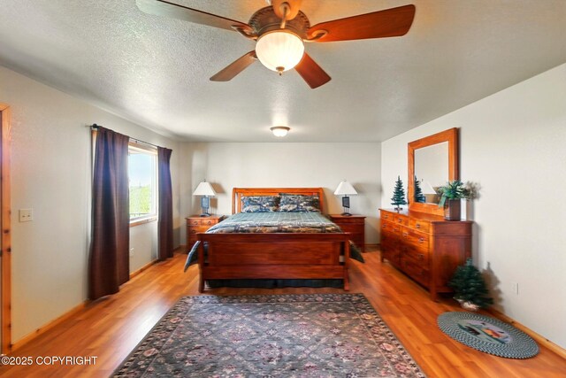 22045 Becharof Cir, Kasilof, AK 99610 - bedroom featuring light wood-type flooring and ceiling fan