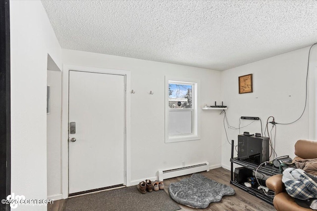 3936 W 88th Ave, Anchorage, AK 99502 - interior space featuring a textured ceiling, wood finished floors, and baseboard heating