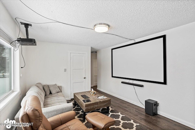 3936 W 88th Ave, Anchorage, AK 99502 - cinema room featuring dark wood-style flooring, baseboards, and a textured ceiling