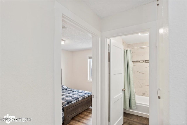 3936 W 88th Ave, Anchorage, AK 99502 - corridor with a textured ceiling and wood finished floors