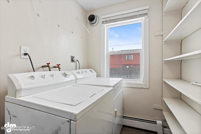 3936 W 88th Ave, Anchorage, AK 99502 - washroom with washer and dryer, a baseboard heating unit, and laundry area