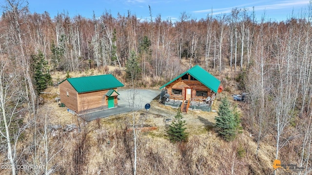 view of play area featuring a wooded view