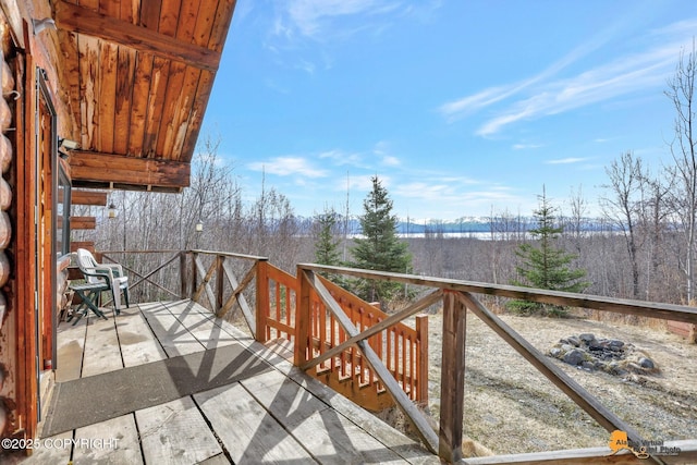 wooden deck featuring a mountain view