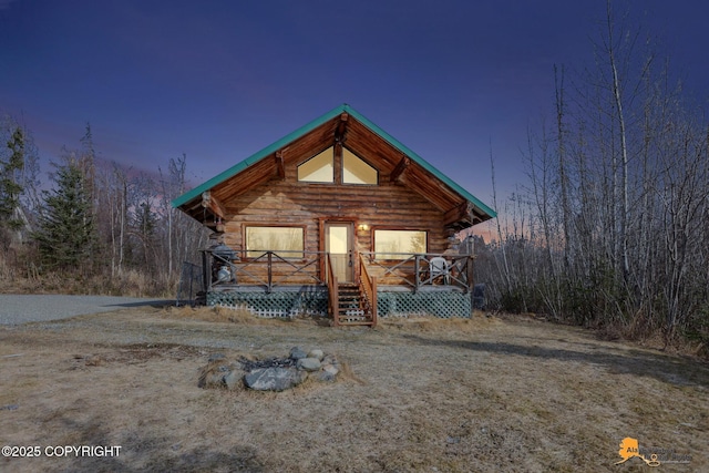 cabin featuring log exterior