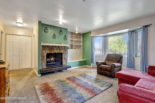 3550 Kachemak Cir, Anchorage, AK 99515 - carpeted living area with a textured ceiling, a stone fireplace, baseboards, and a baseboard radiator