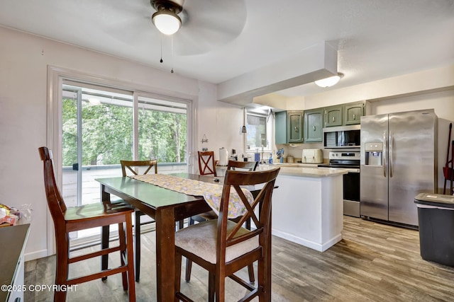 3550 Kachemak Cir, Anchorage, AK 99515 - dining space featuring ceiling fan and light wood finished floors