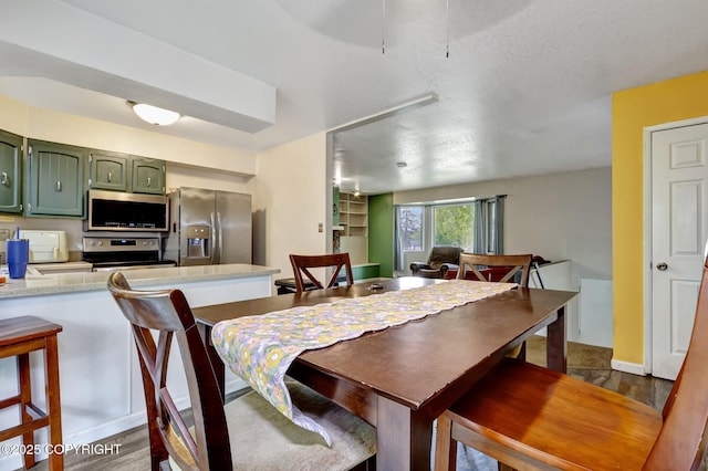 3550 Kachemak Cir, Anchorage, AK 99515 - dining area featuring dark wood-type flooring and a ceiling fan