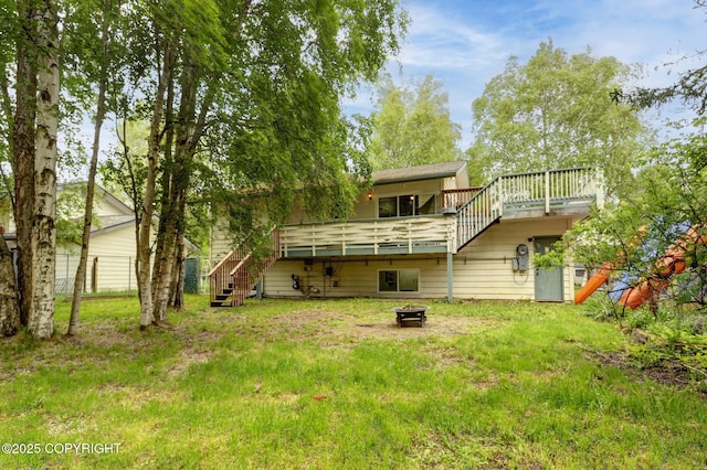 3550 Kachemak Cir, Anchorage, AK 99515 - back of house featuring an outdoor fire pit, stairway, a wooden deck, and a yard