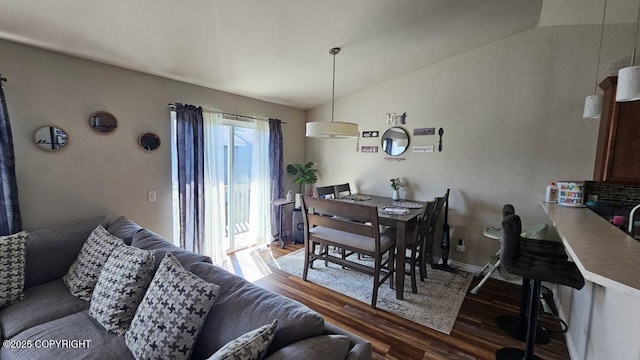 6244 Ophir Dr, Anchorage, AK 99504 - dining space featuring wood finished floors and vaulted ceiling