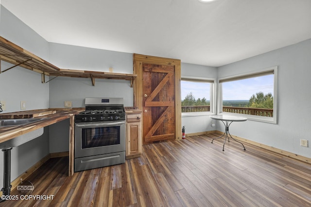 8153 Stewart Mountain Dr, Eagle River, AK 99577 - kitchen with gas range, a sink, dark wood finished floors, and butcher block countertops