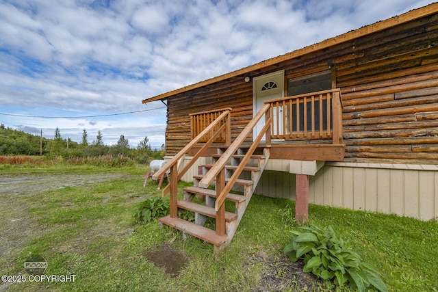 8153 Stewart Mountain Dr, Eagle River, AK 99577 - doorway to property with log exterior and metal roof