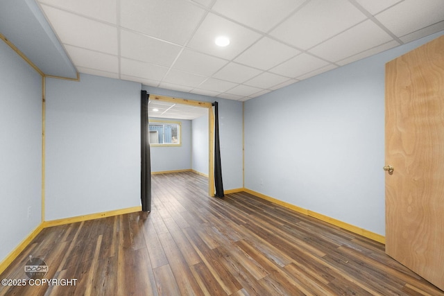 8153 Stewart Mountain Dr, Eagle River, AK 99577 - unfurnished room with wood finished floors, a drop ceiling, and baseboards